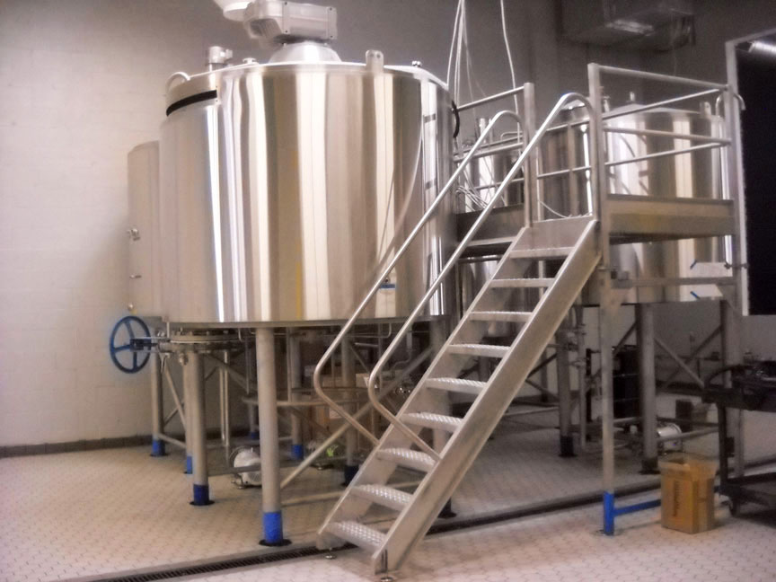 Stainless brewing vessels with a service stair